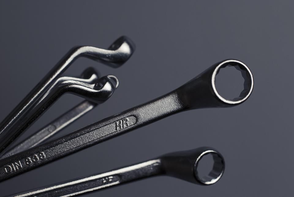 Wrenches on a dark surface